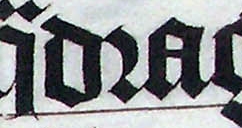 حرف "r" (الحرف الأوسط) في كلمة "quadraginta" في نسخة لاتينية من الكتاب المقدس تعود لعام 1407، معروضة في دير مالمسبري، ويلتشير، إنجلترا