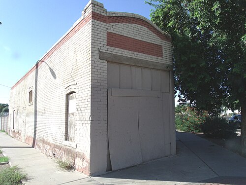 The K.S. Tang Grocery building was built in 1914 and is located at 901 Northwest Grand Avenue. The property was leased to Chinese grocers, Yung Yee Ghee from 1916 to 1920, and to K. S. Tang from 1928 to 1937. This property is recognized as historic by the Asian American Historic Property Survey. On October 1, 1985, the building was listed in the National Register of Places together with its neighbor, the Durand Grocery as Durand Grocery, ref. #85002891.