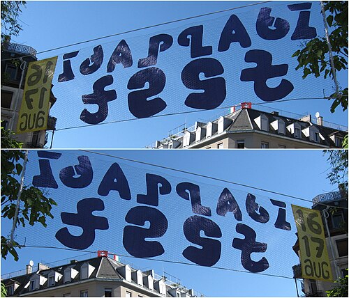 تطبيق عملي للرسومات المتناظرة في لافتة مكتوب عليها "Idaplatz fest" من الأمام والخلف (زيورخ، 2008).
