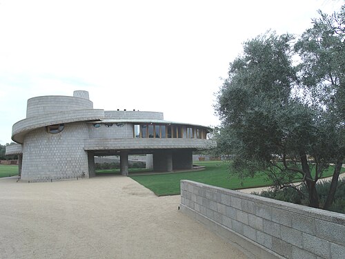 The David and Gladys Wright House was built from 1950-1952 and is located at 5212 East Exeter Boulevard, but currently has an entrance on the 4500 block of North Rubicon Avenue. The house was built in the Arcadia section of Phoenix as part of a Frank Lloyd Wright magazine story circa 1948 on how to live in the desert southwest. Both the circular design and the spiral ramps are features Wright also used in his design of the Solomon R. Guggenheim Museum. After Wright's death in 1959, his son David and daughter-in-law Gladys lived in the home until his death in 1997 at 102 years of age and his widow, Gladys, died in 2008 at 104, outliving their only son, who died at 49 years of age. David and Gladys were the only owners of the home and lived in it their entire lives. As of early 2022 the house has been registered on the national list of historic places.