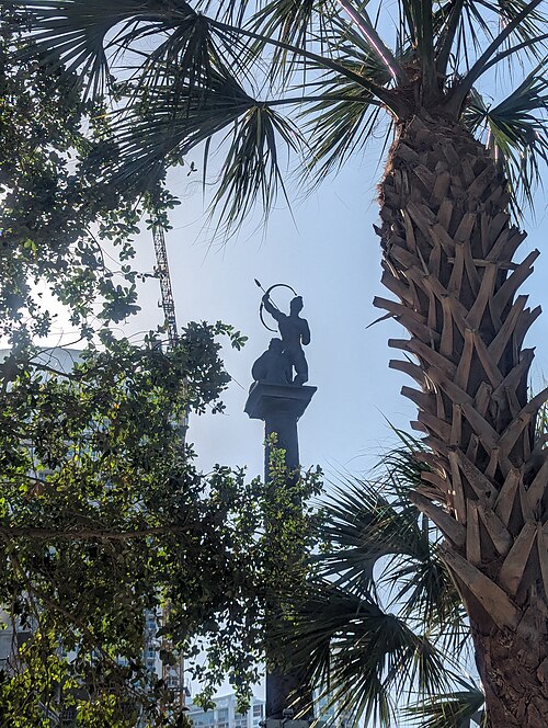Pillar of History by Manuel Carbonell, viewed from the ground; the statue is a symbol of the district
