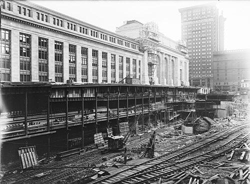 A large excavated area beside the station while under construction