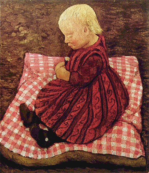 إلزبيث مودرسون على وسادة حمراء (حوالي 1904)