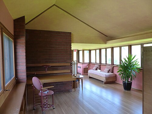 Johnson's daughter's bedroom, a narrow space with a sloped ceiling and windows to the left and right