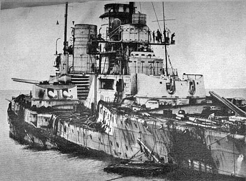 A black and white image of a heavily damaged German naval ship