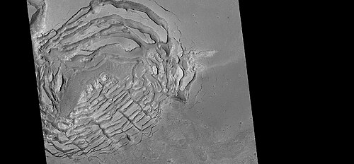 Large group of concentric cracks, as seen by HiRISE, under HiWish program Location is Ismenius Lacus quadrangle. Cracks were formed by a volcano under ice.