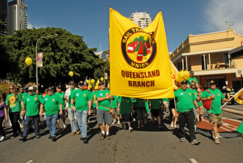 RTBU supporters carrying a banner in the Brisbane Labour Day March, 2012