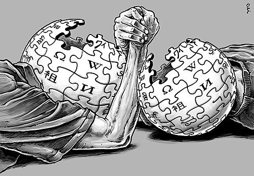 رسم توضيحي لشخصين، كلاهما يحمل شعار "كرة الأحجية" الخاص بموقع ويكيبيديا بدلاً من رأسيهما، يتصارعان بالأذرع مع بعضهما البعض.