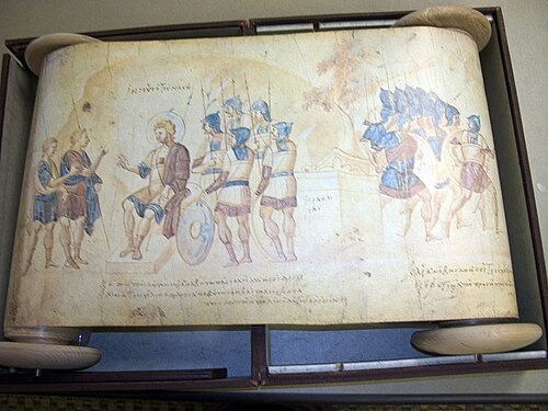صورة لمخطوطة مصورة مكتوبة باللغة اليونانية. على اليسار، شخصان يقفان ويتحدثان إلى شخص جالس، بينما يستمع خمسة جنود. على اليمين، مجموعة من الجنود يغادرون المكان.