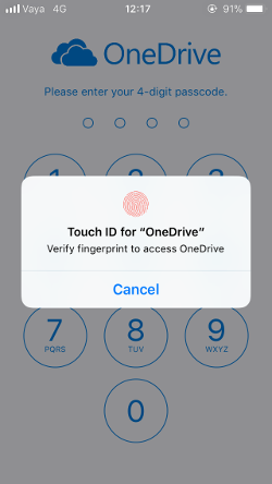 لقطة شاشة لشاشة رمز المرور في OneDrive على نظام iOS 11، مع ظهور مطالبة فتح القفل باستخدام Touch ID.